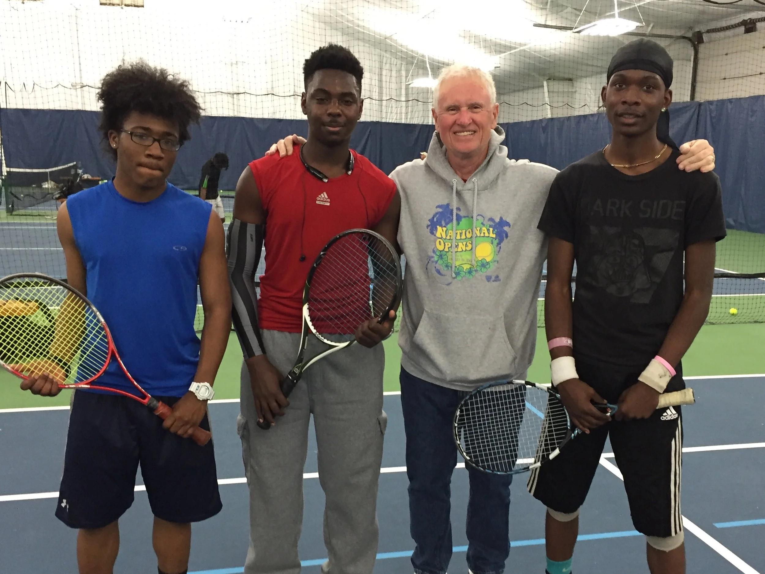 First Serve Bridgeport Board member, Ed Paige, and current players, after a good practice indoors.