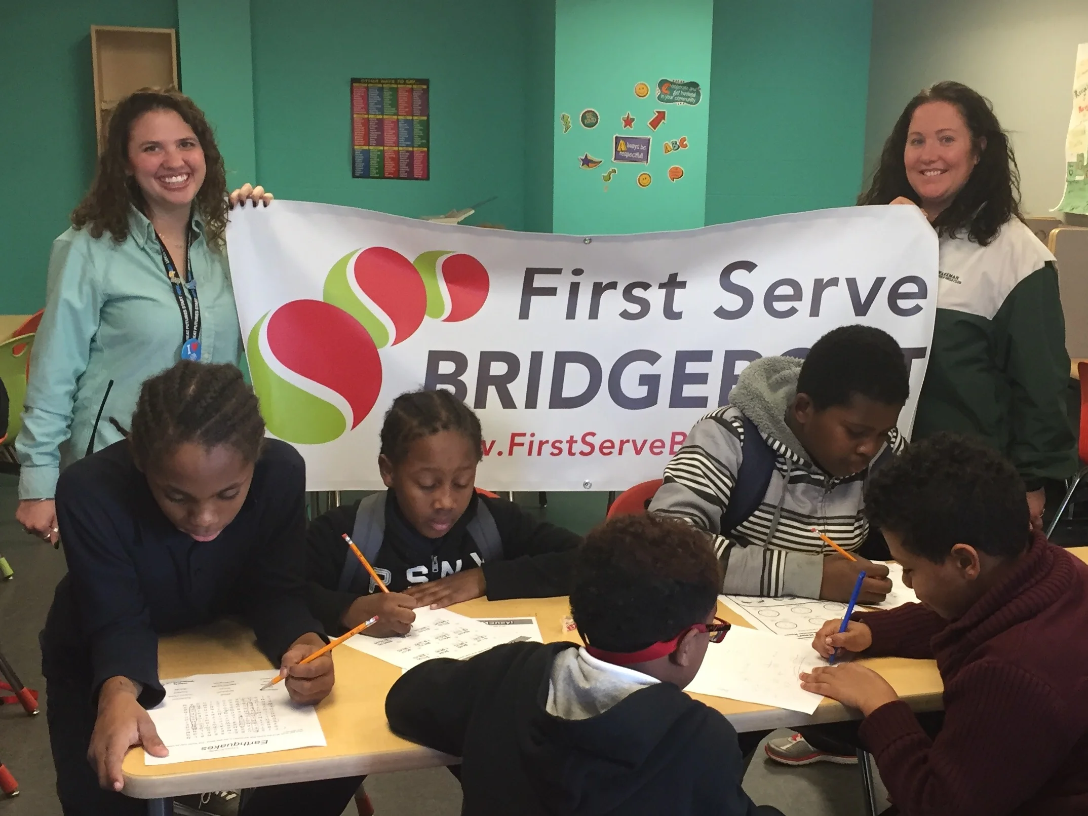 First Serve Bridgeport supporting team members in the classroom.