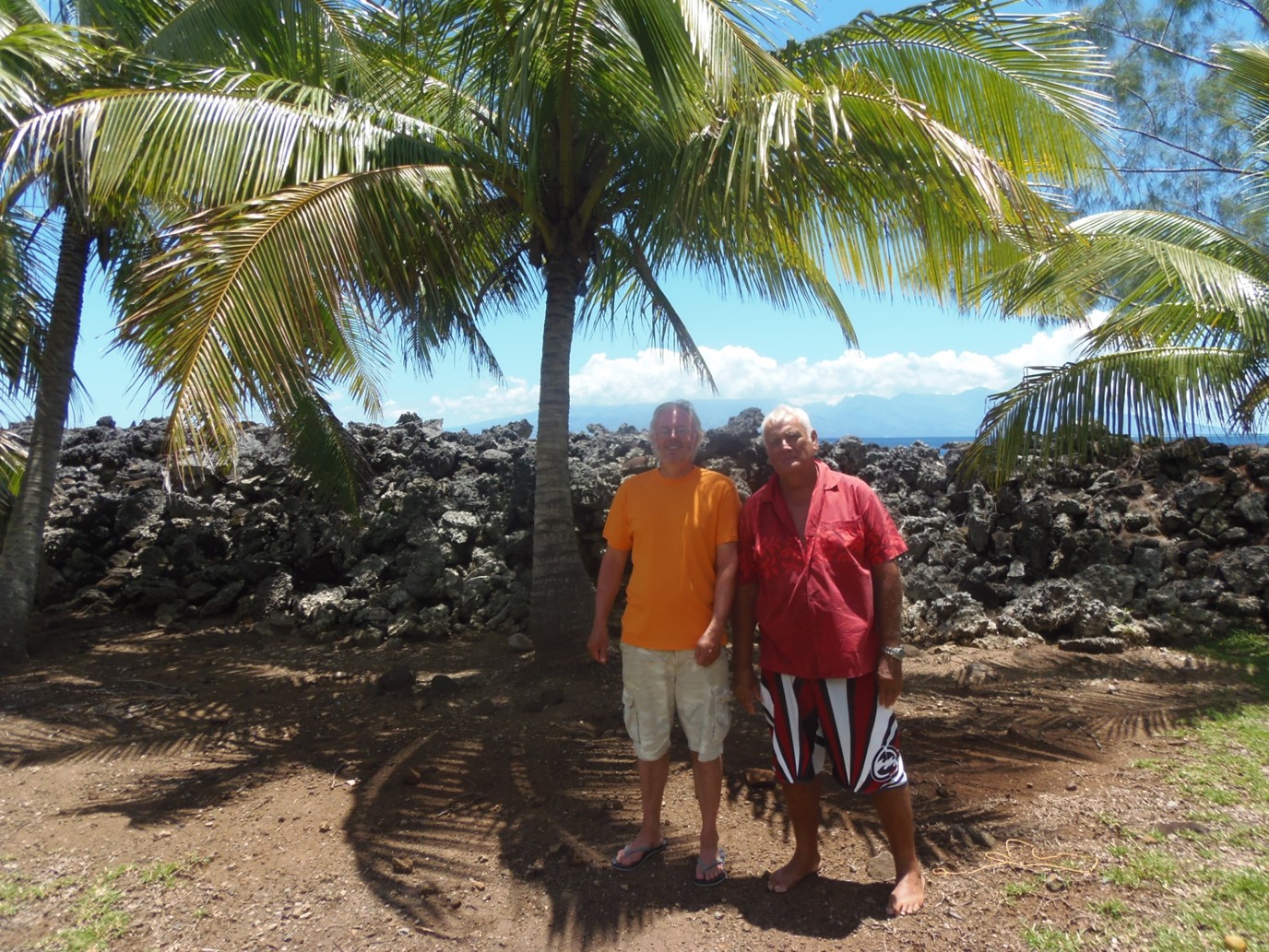 Jeff Sissons and local leader Ato Fogier standing in front of a ruined Marae in Moorea.