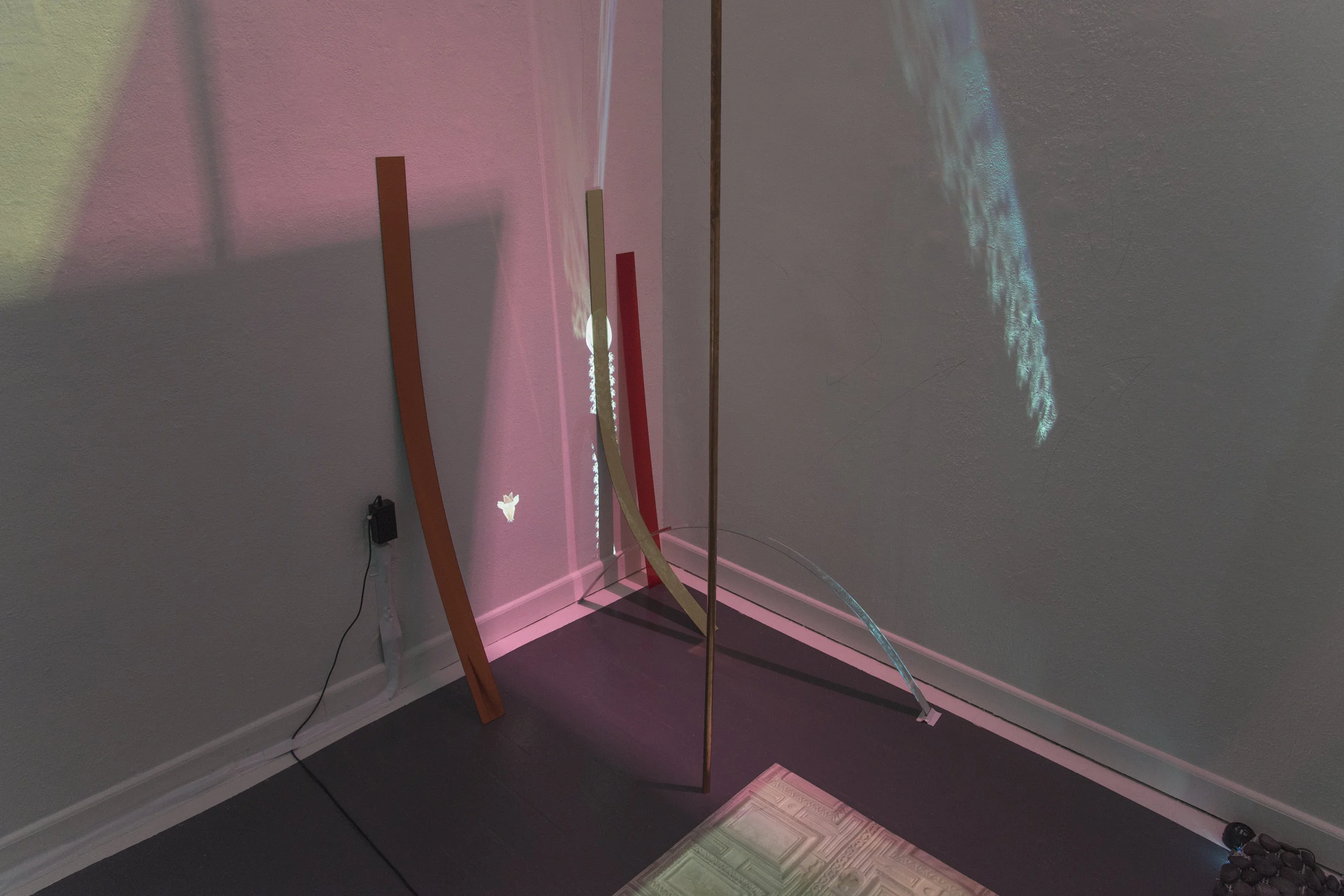 Hand Memorials + Sail Angels, 2015, HD video, 2 projectors, plastic strips, rocks, dimensions variable, detail