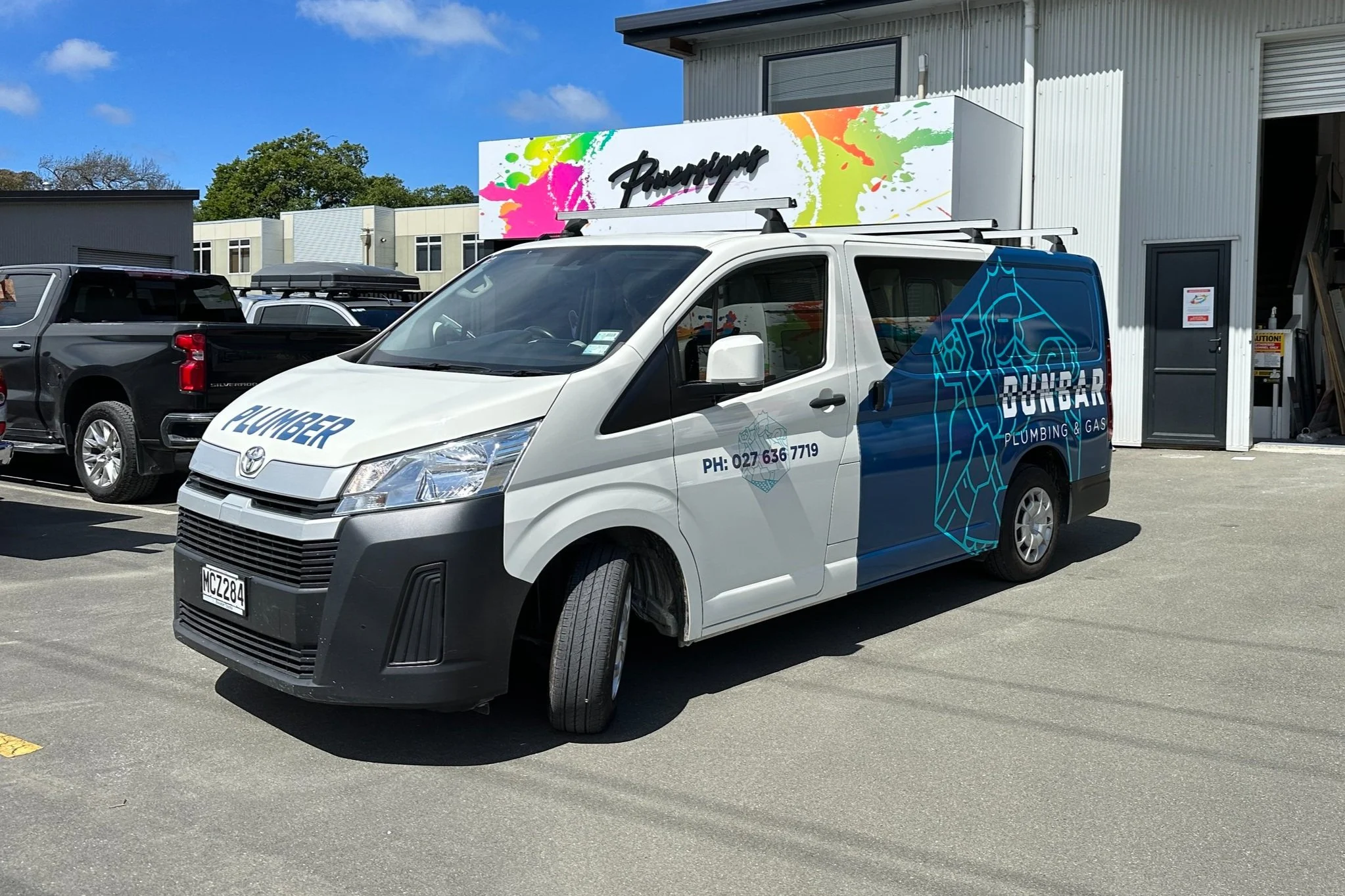 partial vehicle wrap on a dunbar plumbing toyota hiace
