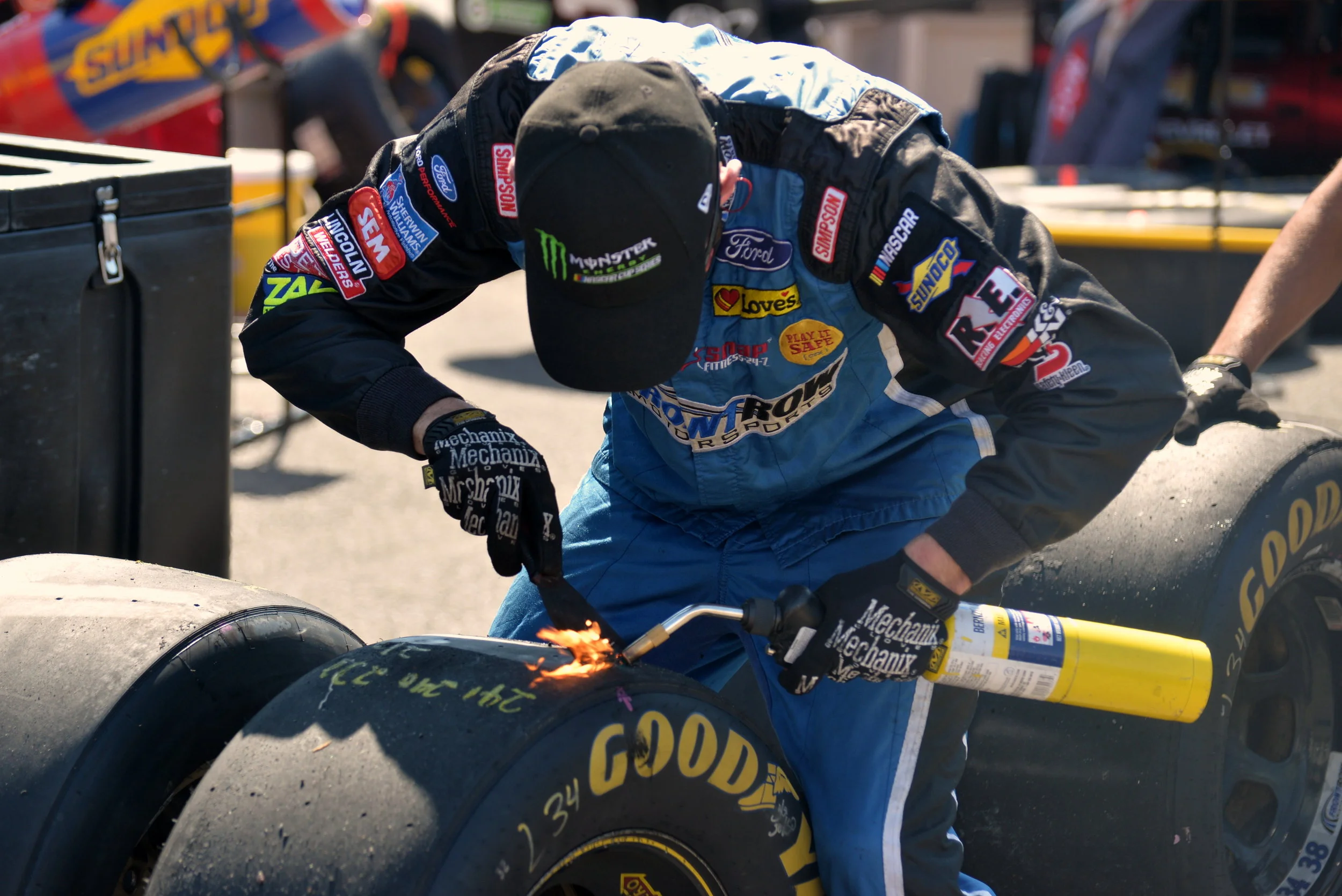 Pit Crew Removing Information From Tire