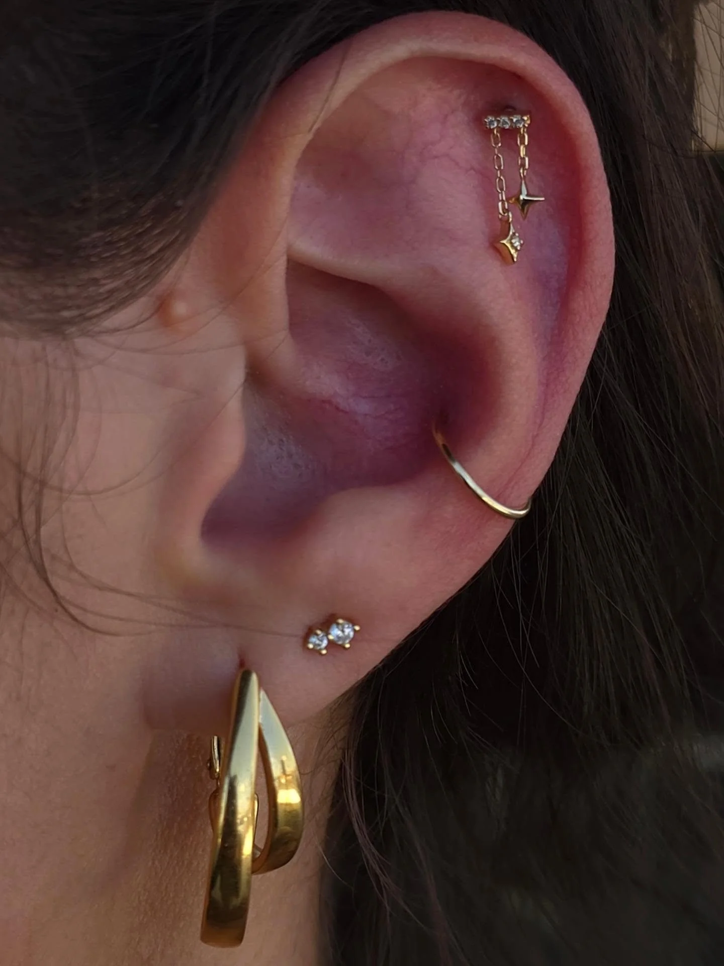 Sometimes you just need a lil jewelry styling to pull everything together. ✨

I really wish I had a before picture... but I don't. 🙃

We swapped her conch to this gold hoop and added the cutest little dangle to her helix.

It's amazing how just a co