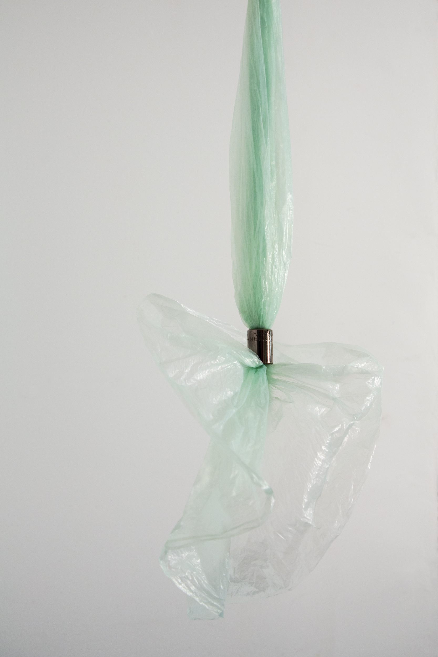    Floating on detritus   (detail)  Used plastic bag and found metal hardware  Approx. 21 5/8” x 7” x 6 1/2”  2018 