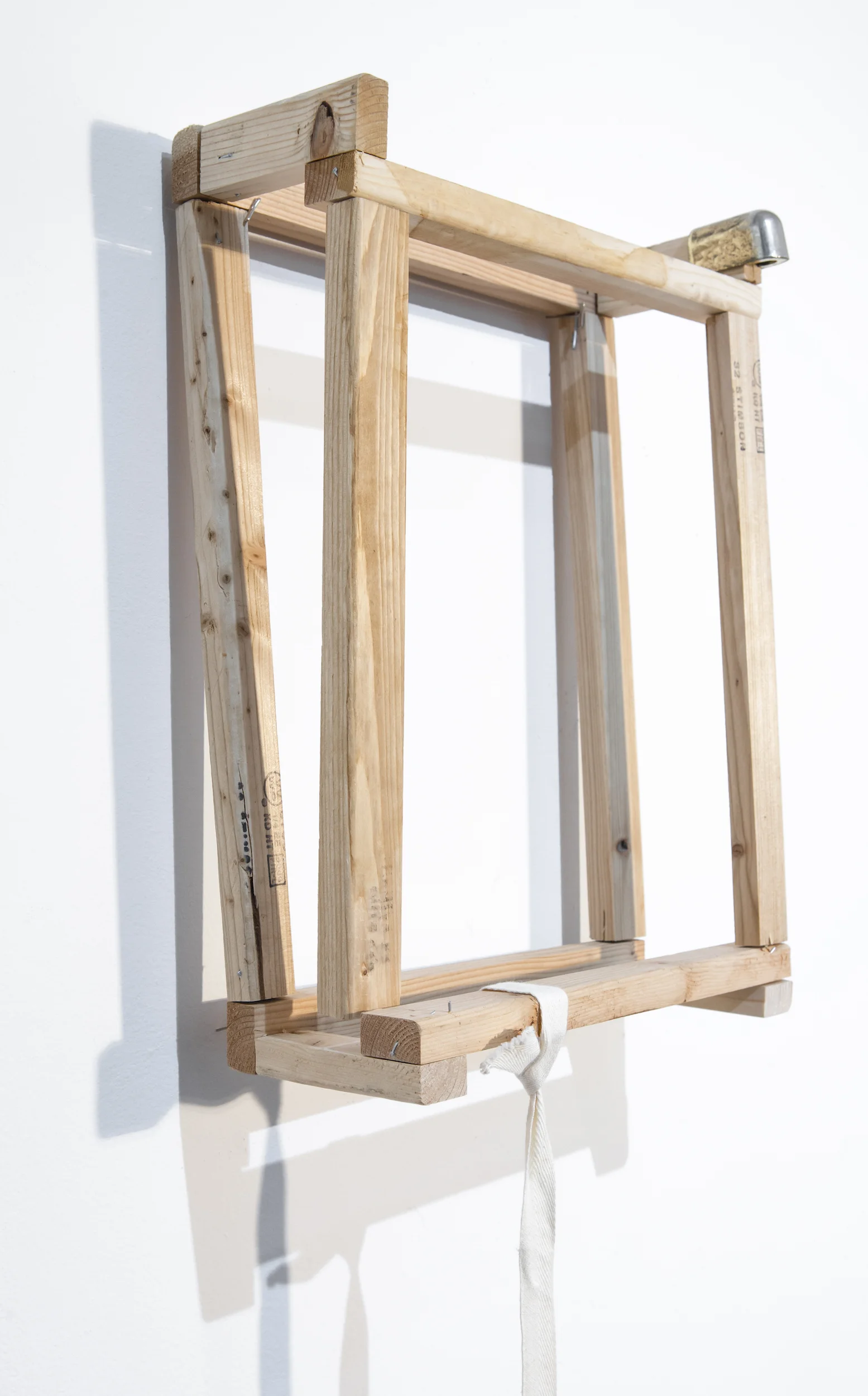 The burden (detail) Found wooden frame and metal cap, used canvas tie and air bubble cushion, and T-pin Approx. 39 x 13 x 10 inches 2018
