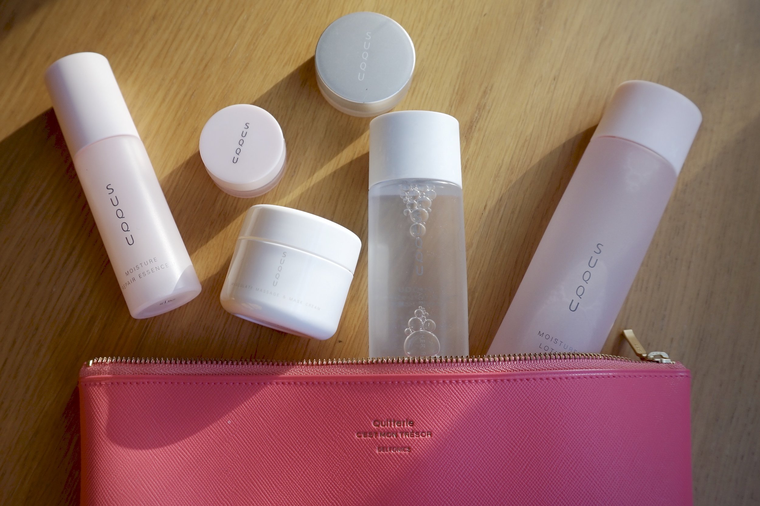 From Left to Right: Moisture repair essence, Moisture barrier cream ( little pink pot), Masculate massage & mask cream (white pot), Lip concentrate balm (silver pot) & Face refresher Moisture lotion.