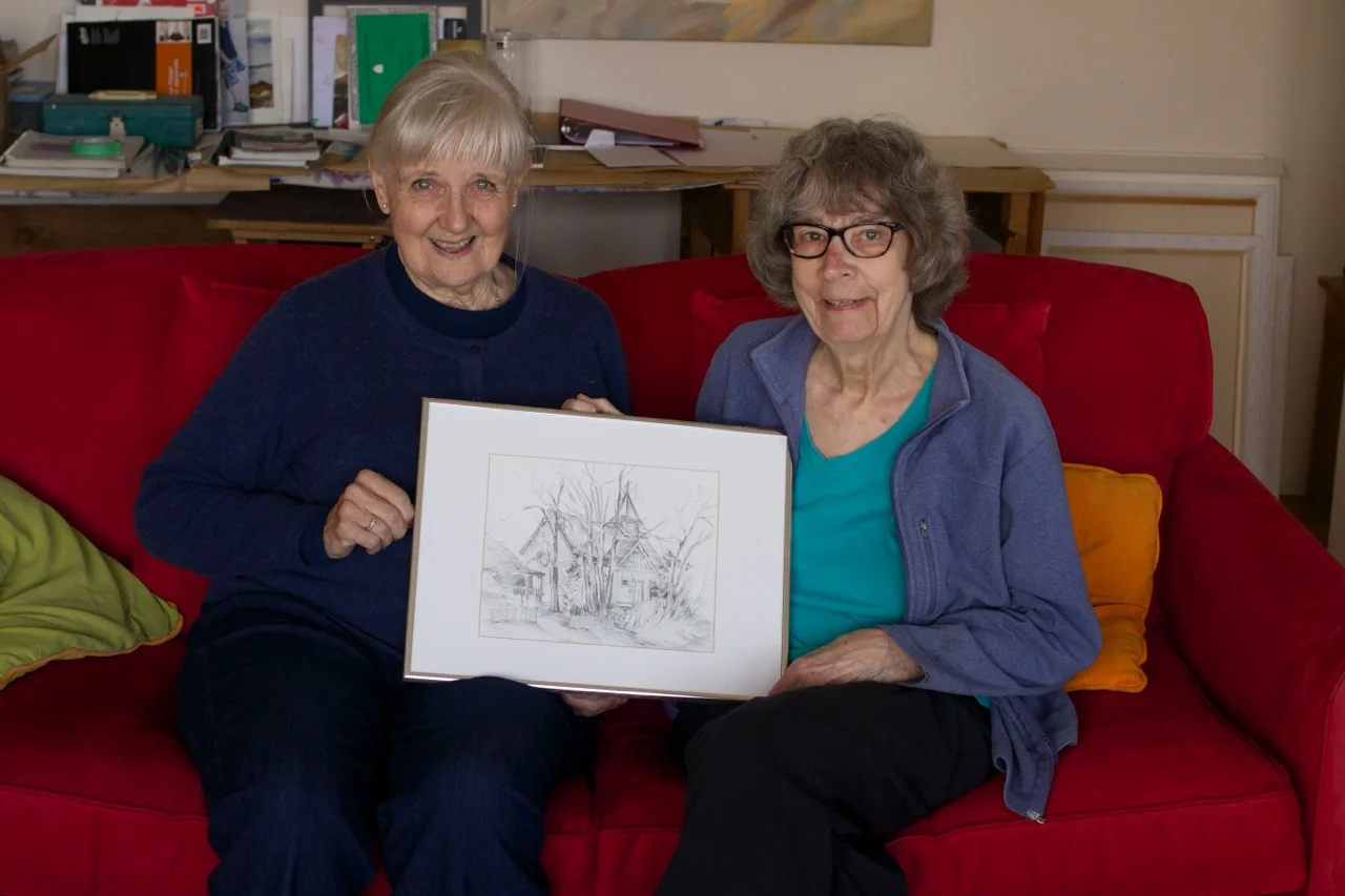 Barbara Wilson and painter, Marie Nagel (formerly of Wells) in Victoria with one of Barb's drawings.