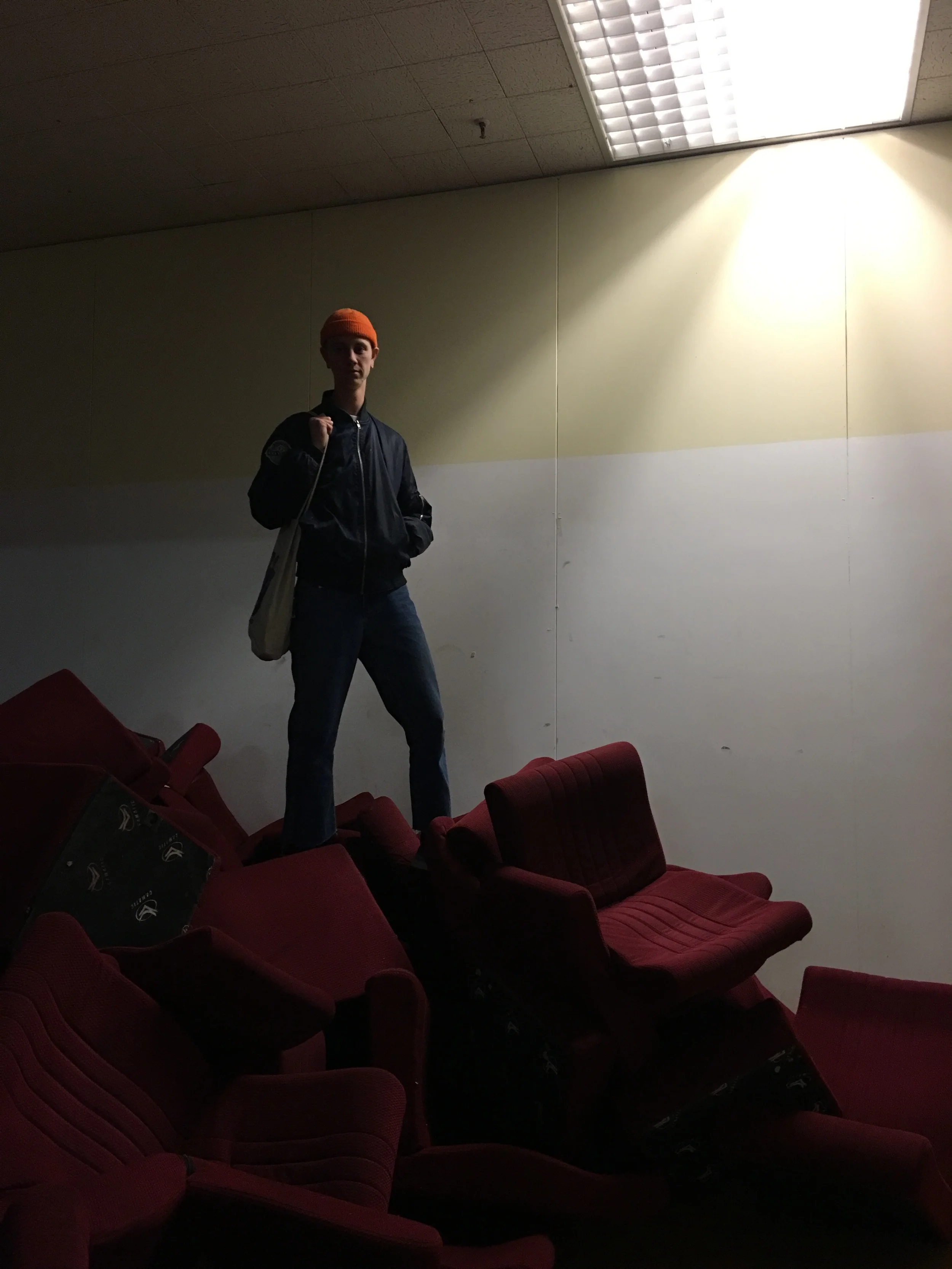 Small mountain of old cinema chairs, featuring Luke