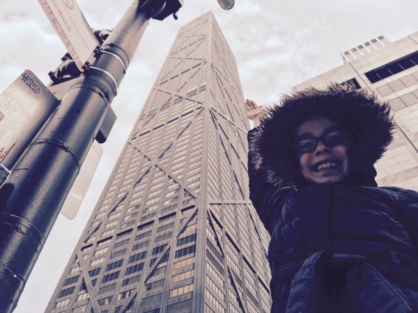 She can almost reach the top of the Hancock Building!
