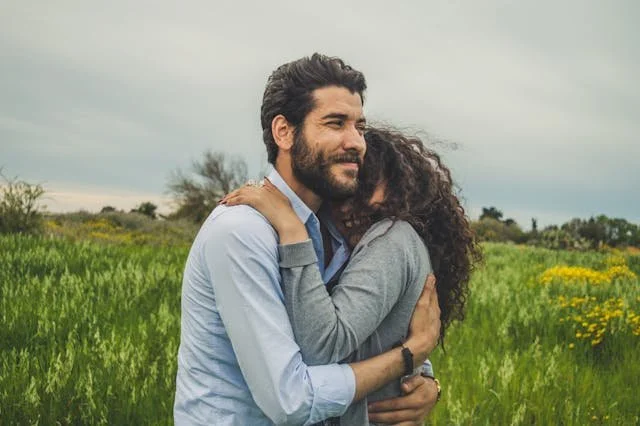 a happy couple in a field