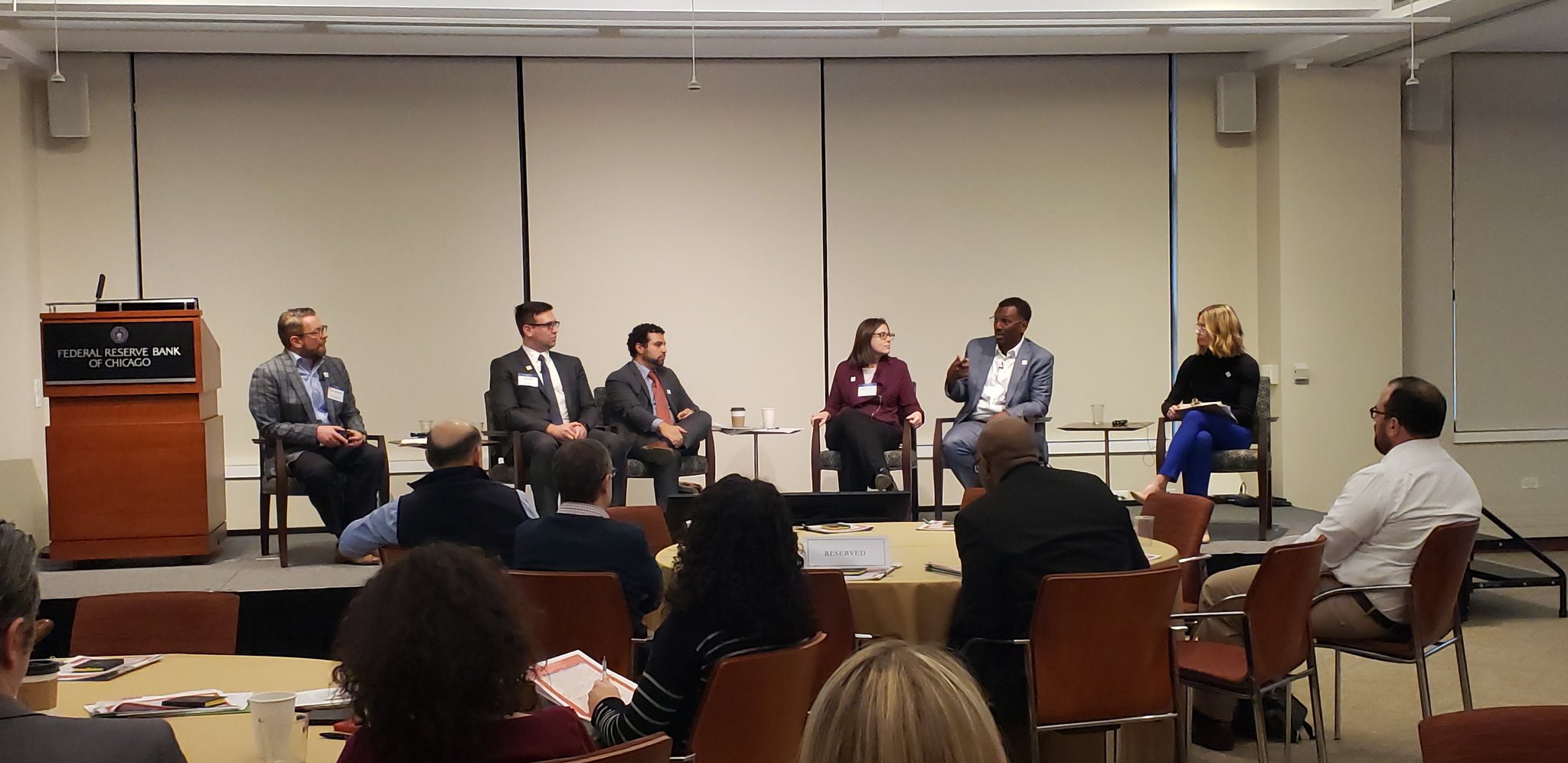 A panel discusses financing for affordable housing and other development types on the South and West Side. Panelists included Jake Schnur from MB Financial, Juan Carlos Linares from LUCHA, Melinda Pollack from Enterprise Community Partners, Ghian Foreman from Washington Park Development Group, and Lori Berko from the University of Chicago’s Arts & Public Life. Kirby Burkholder, from IFF, moderated. The discussion included healthy skepticism of the potential investment impact of Opportunity Zones in the geographic areas that these real estate industry leaders work in. Photo: Rachel Ruttle for Elevated Chicago