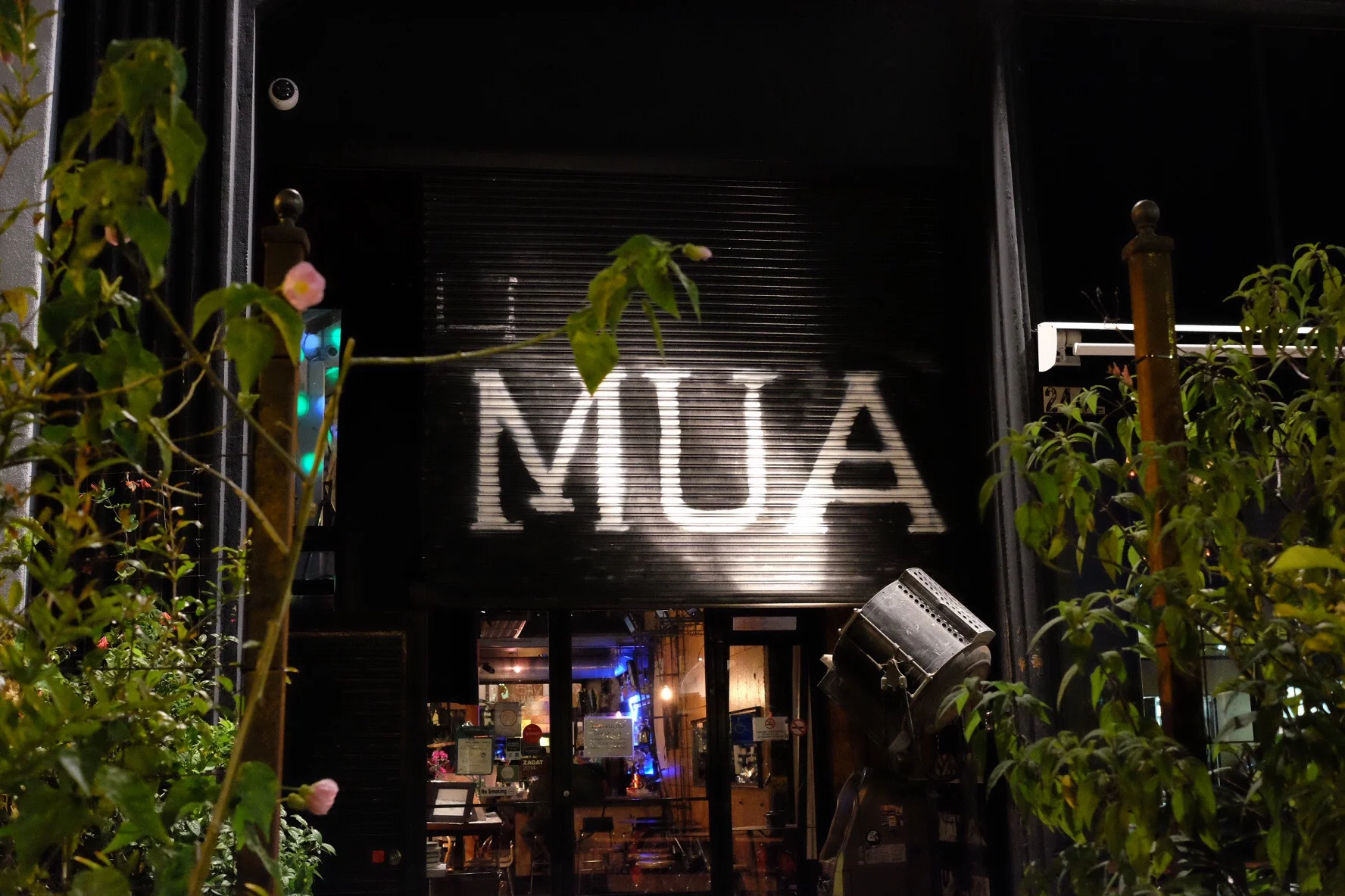 The restaurant's sign is illuminated by a vintage spotlight. Photo by Pam.