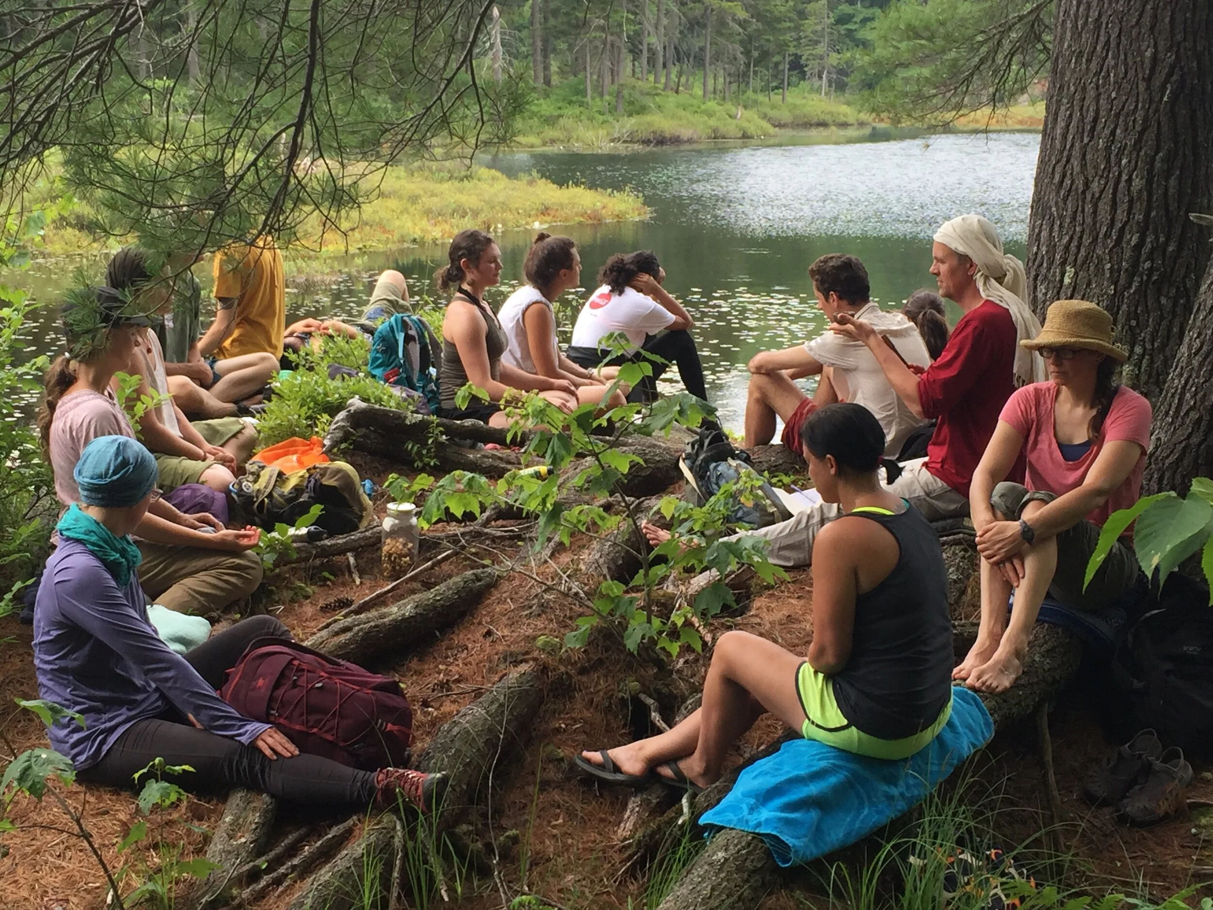 Practicing sitting meditation during a group hike.