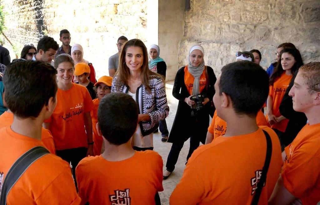 Queen Rania of Jordan visits the site and greets volunteers. 