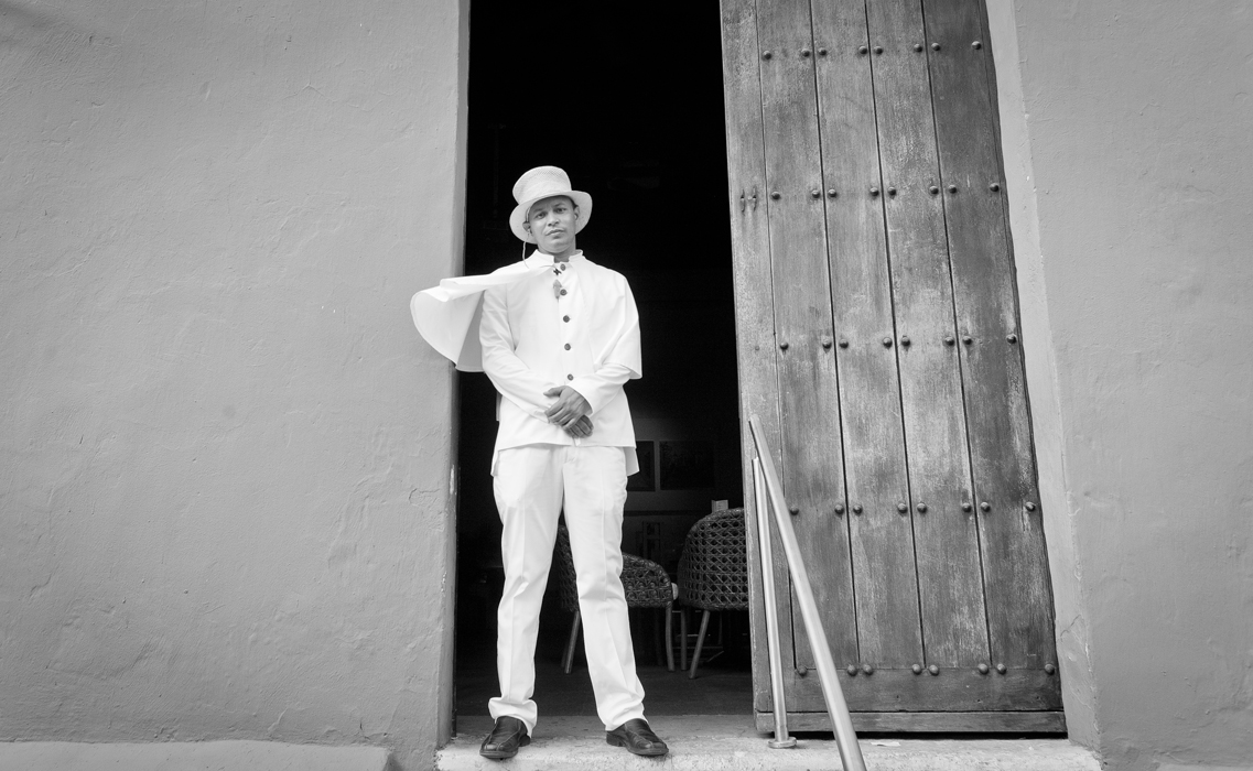 Bar Doorman in White Cape and Hat