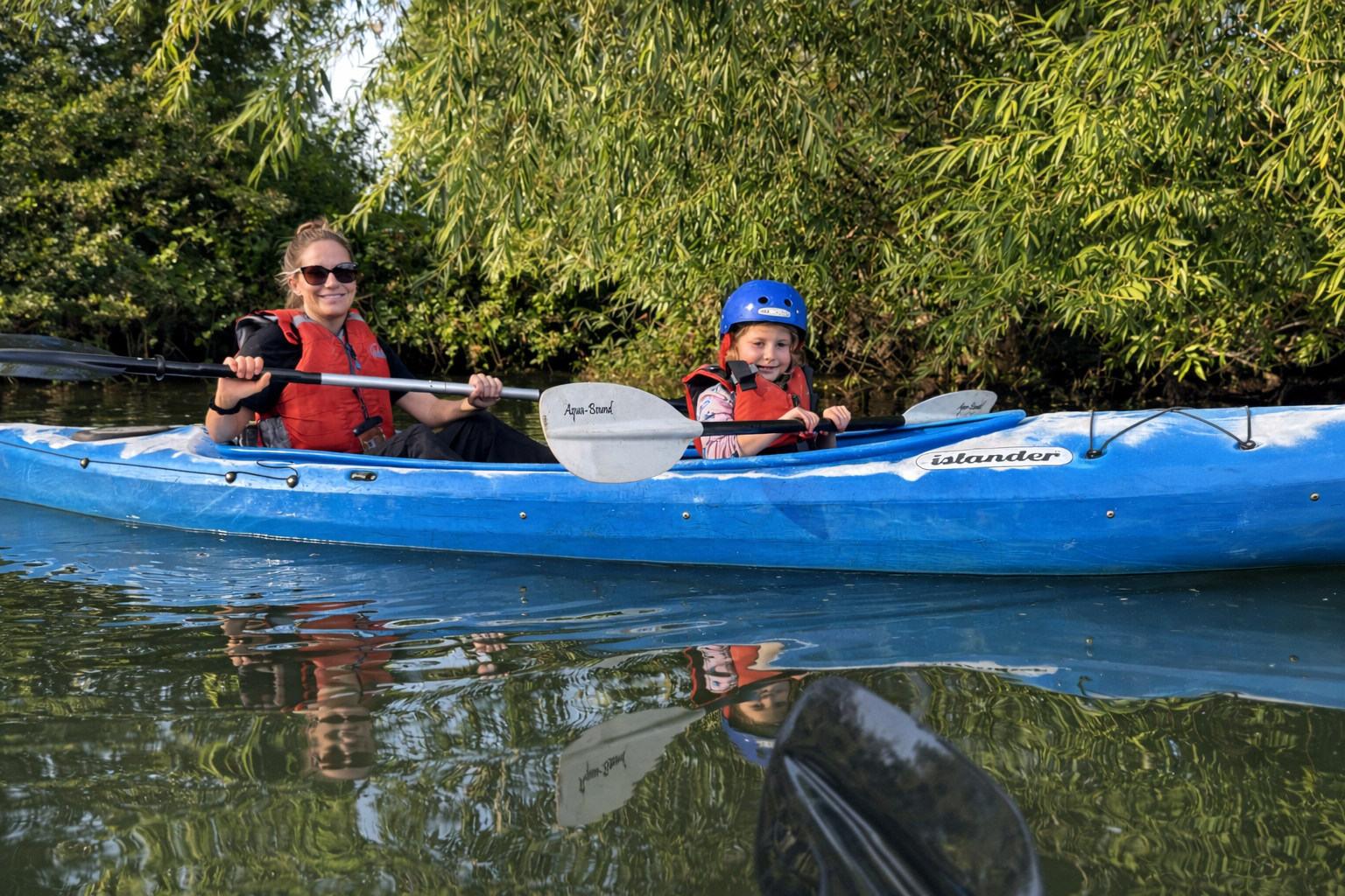 Paddling together on a calm river.png