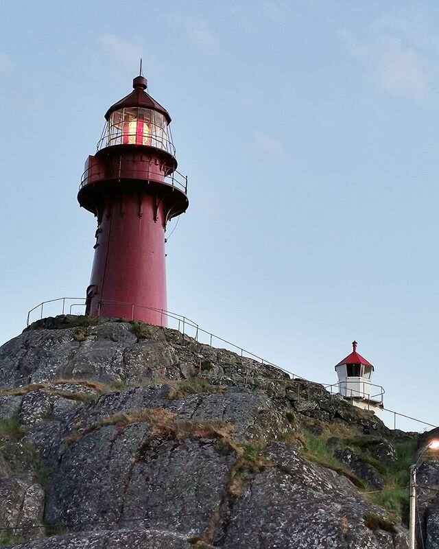 Bright lighthouse shining in the summer night in Norway #thetravelinspector #travellersagainstracism #ilovethesea #ilovethemountain #onafyr