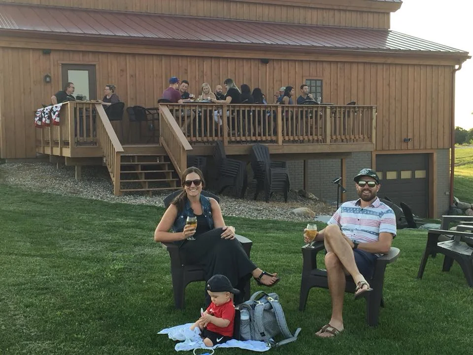 couple and kid in yard.jpg