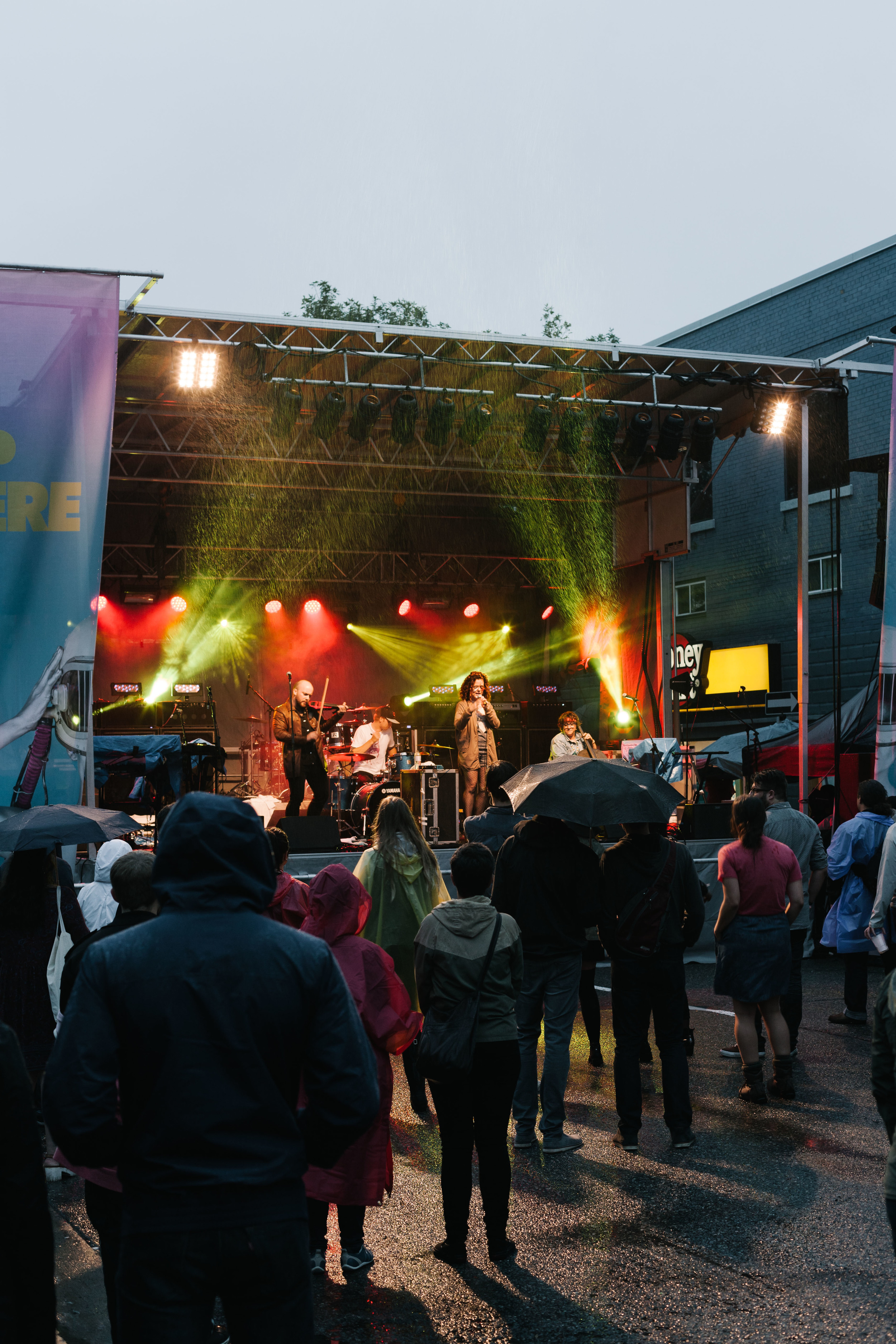 Residents braving the rain for one of the outdoor performances