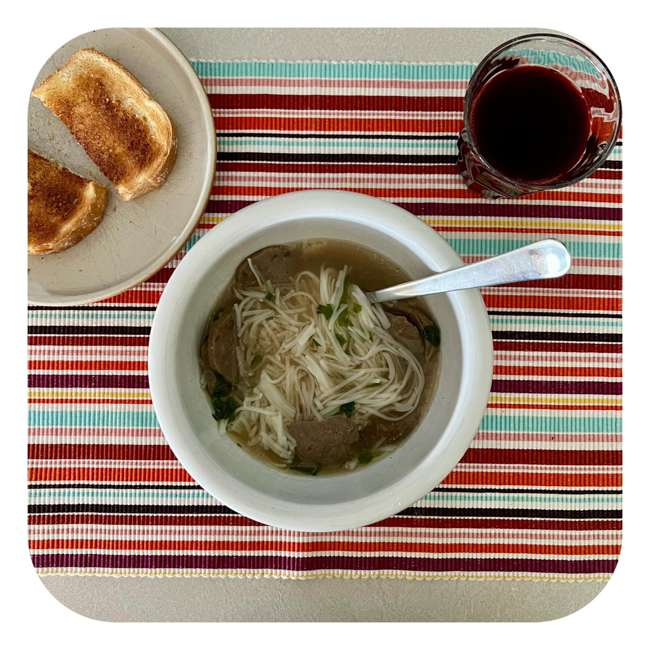 421 cals &bull; Late lunch/early dinner: the rest of yesterday&rsquo;s beef pho soup, 1 slice buttered white bread, beet juice.