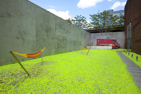  Exterior Installation View,  University of Trash, 2009 , dimensions variable, recycled wood, hammocks, the  M49 Radio Transmitter Truck  with Low-power radio transmitter, and internet radio station, on loan by Max Goldfarb, gravel from the exhibitio