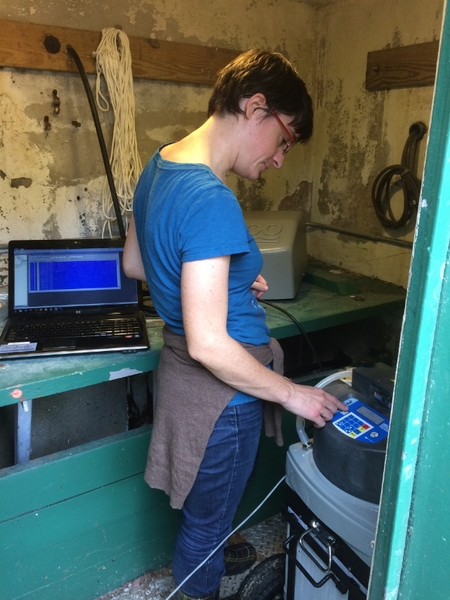 MyRWA scientist Veronique Vicard is programming the autosampler stationed at the Aberjona River.