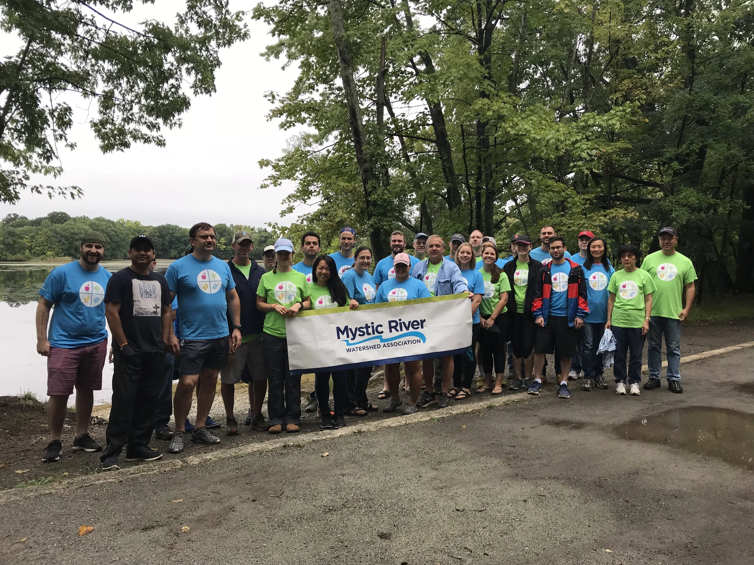 Volunteers from Perkin Elmer helped remove water chestnuts in 2018.