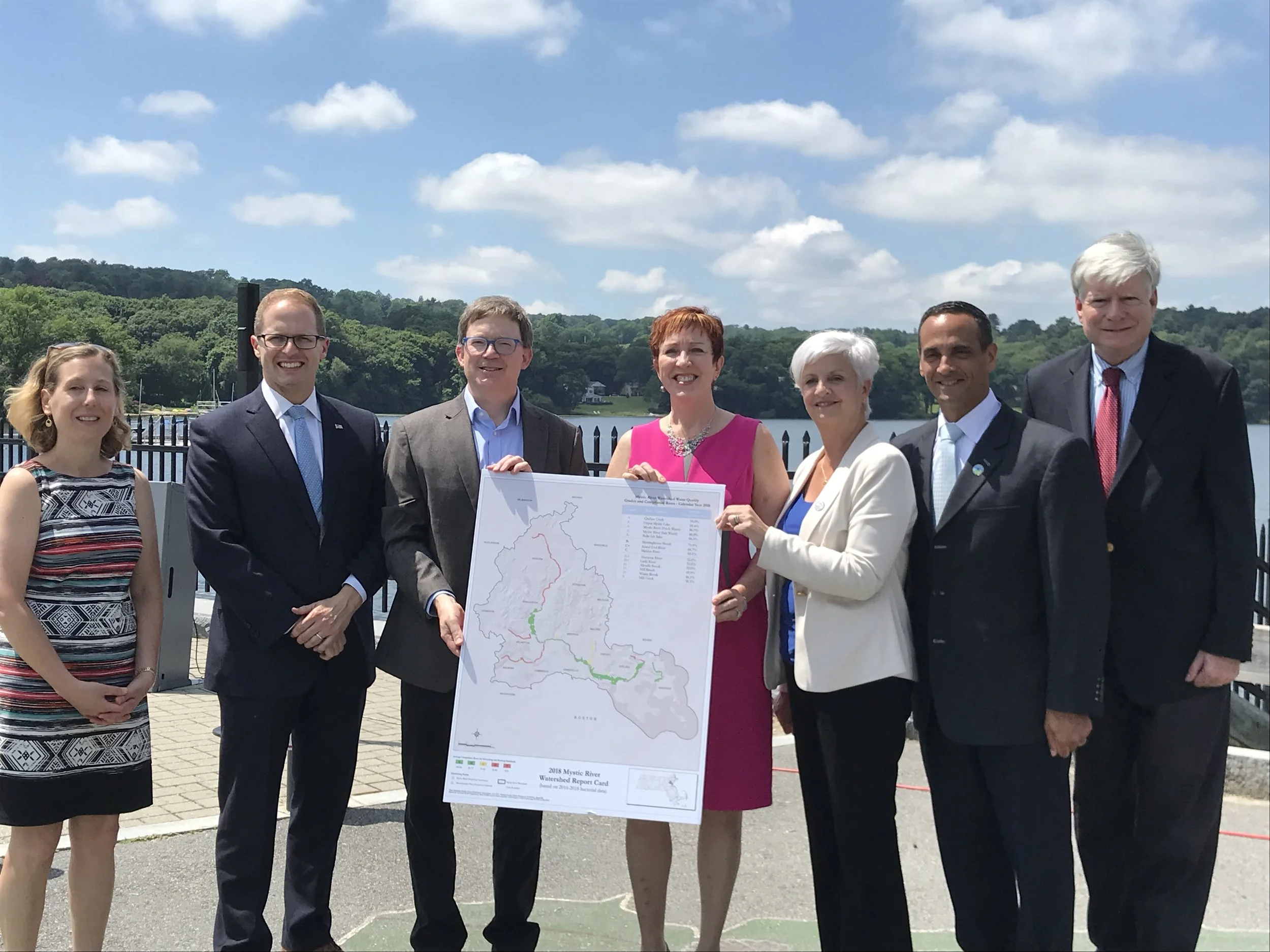 Pictured Left to Right: Stephanie Cooper, Deputy Commissioner for Policy and Planning at MassDEP, Adam Chapdelaine, Arlington Town Manager, Patrick Herron, Executive Director of the Mystic River Watershed Association, Deborah Szaro, Acting Commissioner of EPA Region 1, Mayor Stephanie Burke, City of Medford, Mayor Joe Curtatone, City of Somerville and Fred Laskey, Executive Director. The Massachusetts Water Resources Authority (MWRA).