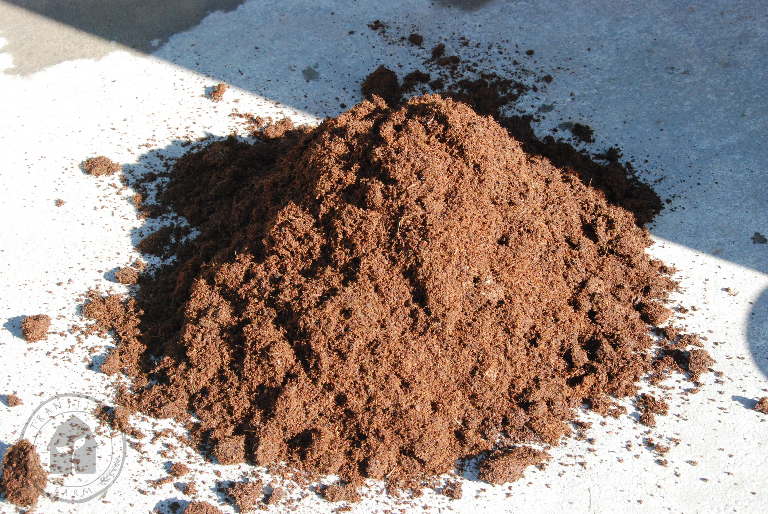   Fill 2 buckets with Coco Peat or Coir and dump on clean concrete pad.  