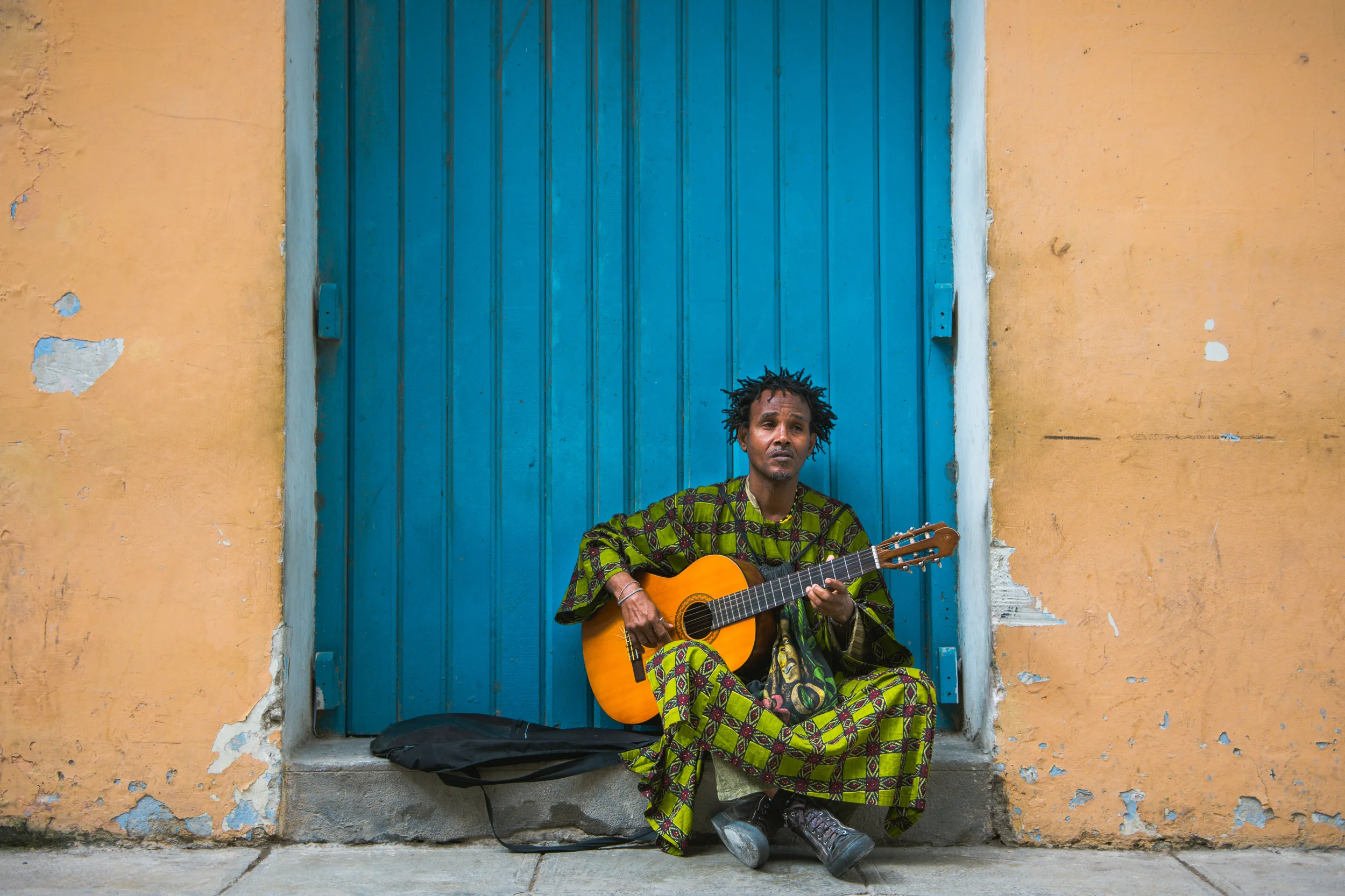 ISO 200 / 30mm/ f2.8 / 1/400sec - Many Cubans make a living on the streets of Old Havana playing music to tourists. 