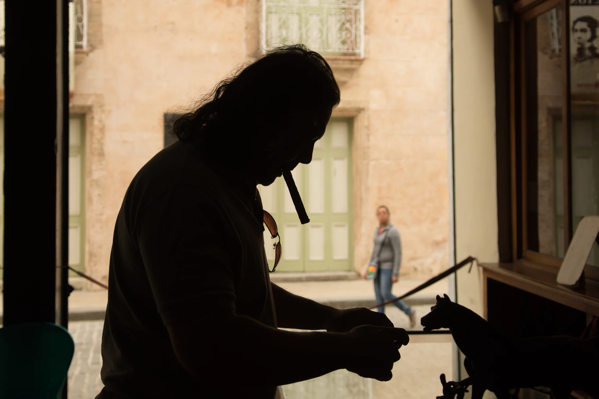 ISO 200 / 23mm / f2.8 / 1/400sec - Silhouette of my dad taking a photo of a display. 