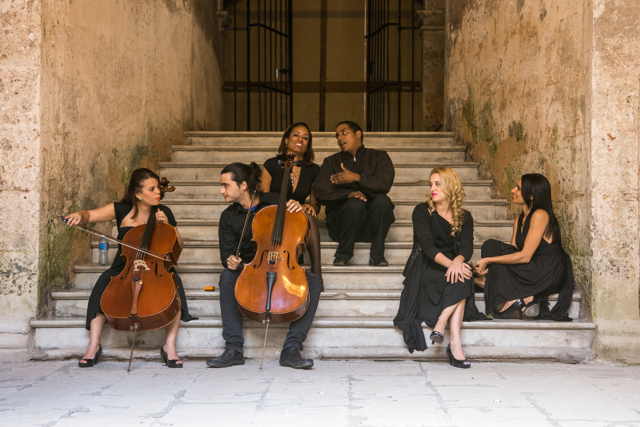 ISO 200 / 44mm / f2.8 / 1/50sec - These are members of the St. Francis of Assisi Orchestra warming up before the big show. 