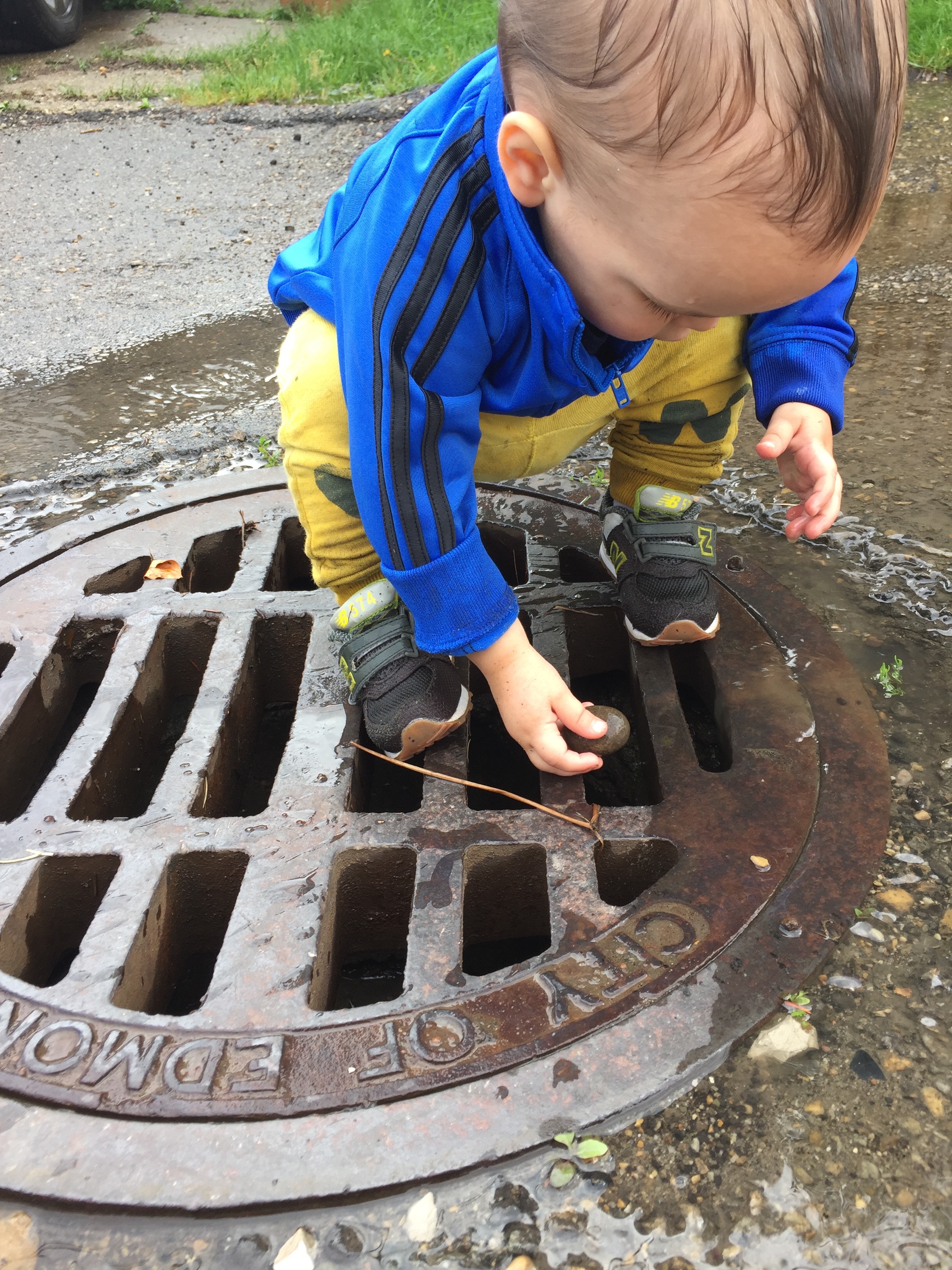 My child playing in a gutter; because, why not? 