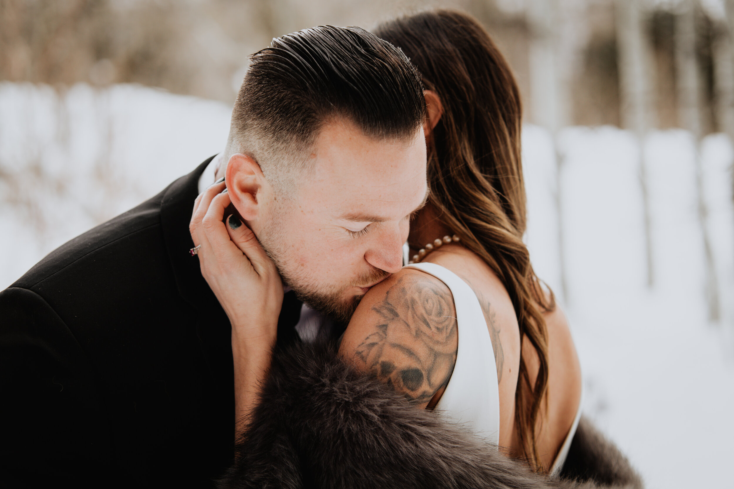 groom-kissing-shoulder.jpg