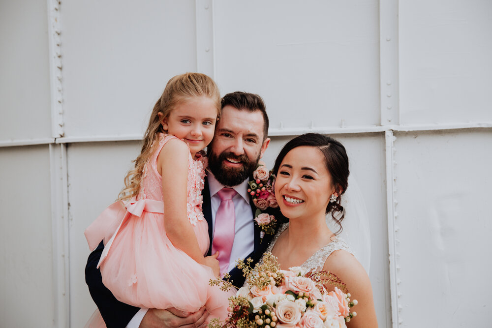 bride and groom with daughter pierpont place.jpg