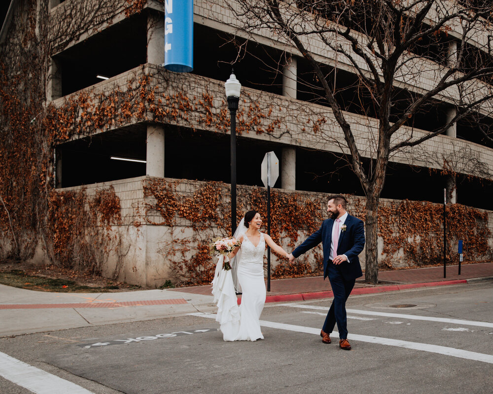 bride and groom crossing street.jpg