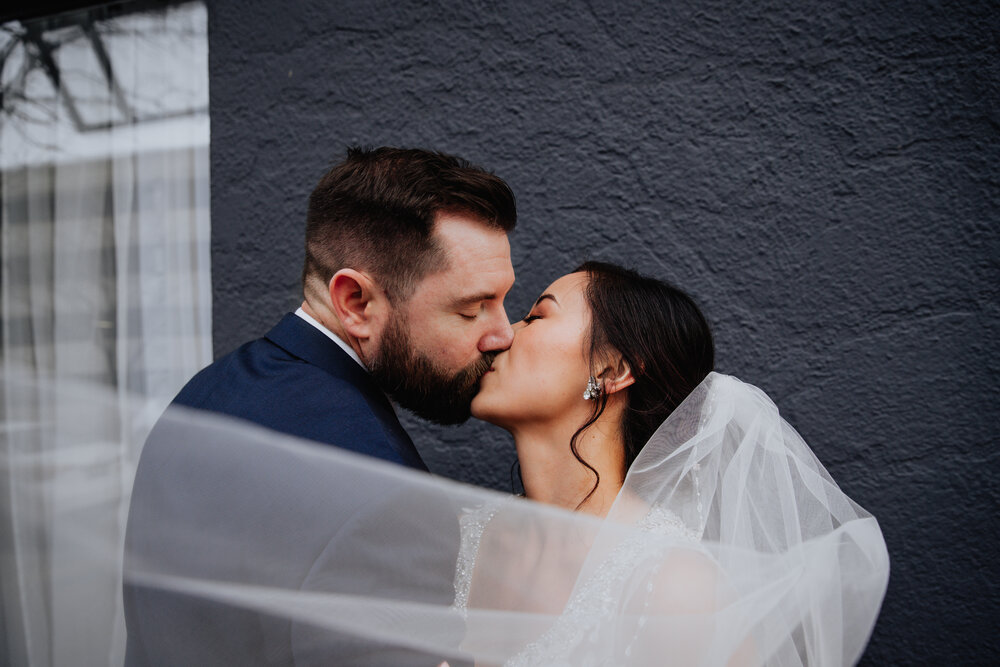 bride and groom kissing pierpont place.jpg