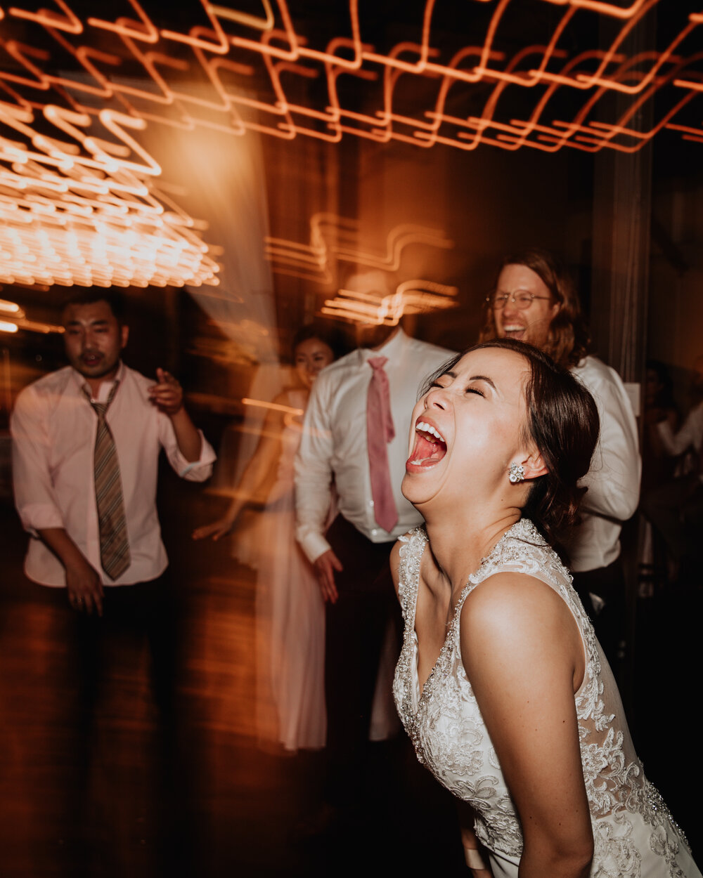 bride laughing at wedding.jpg