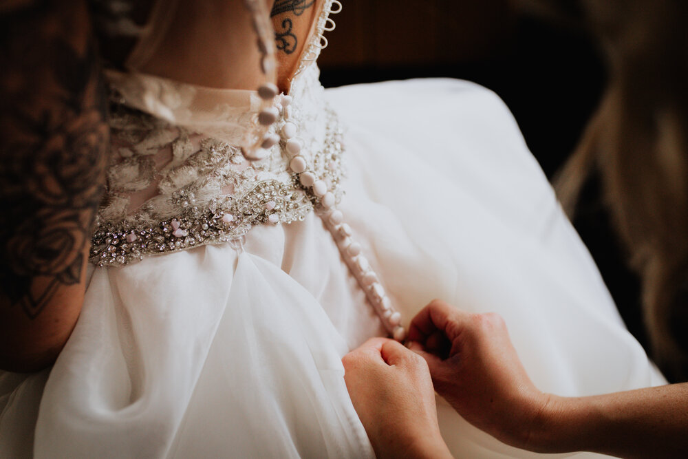 buttoning up wedding dress.jpg