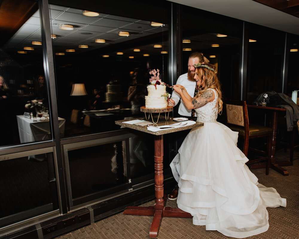 bride and groom cutting cake.jpg