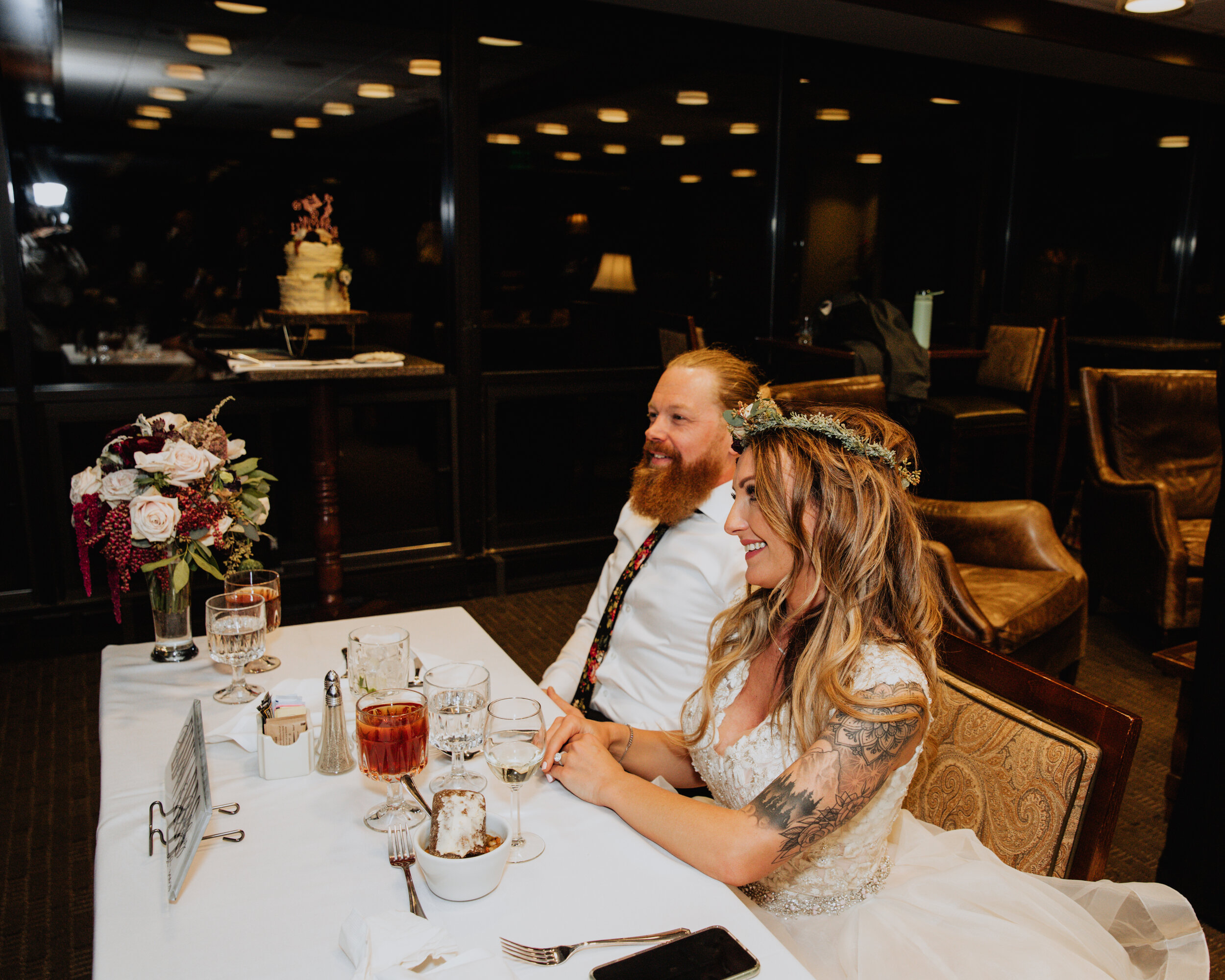 bride and groom during speeches.jpg