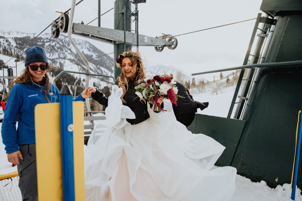 bride getting off ski lift.jpg