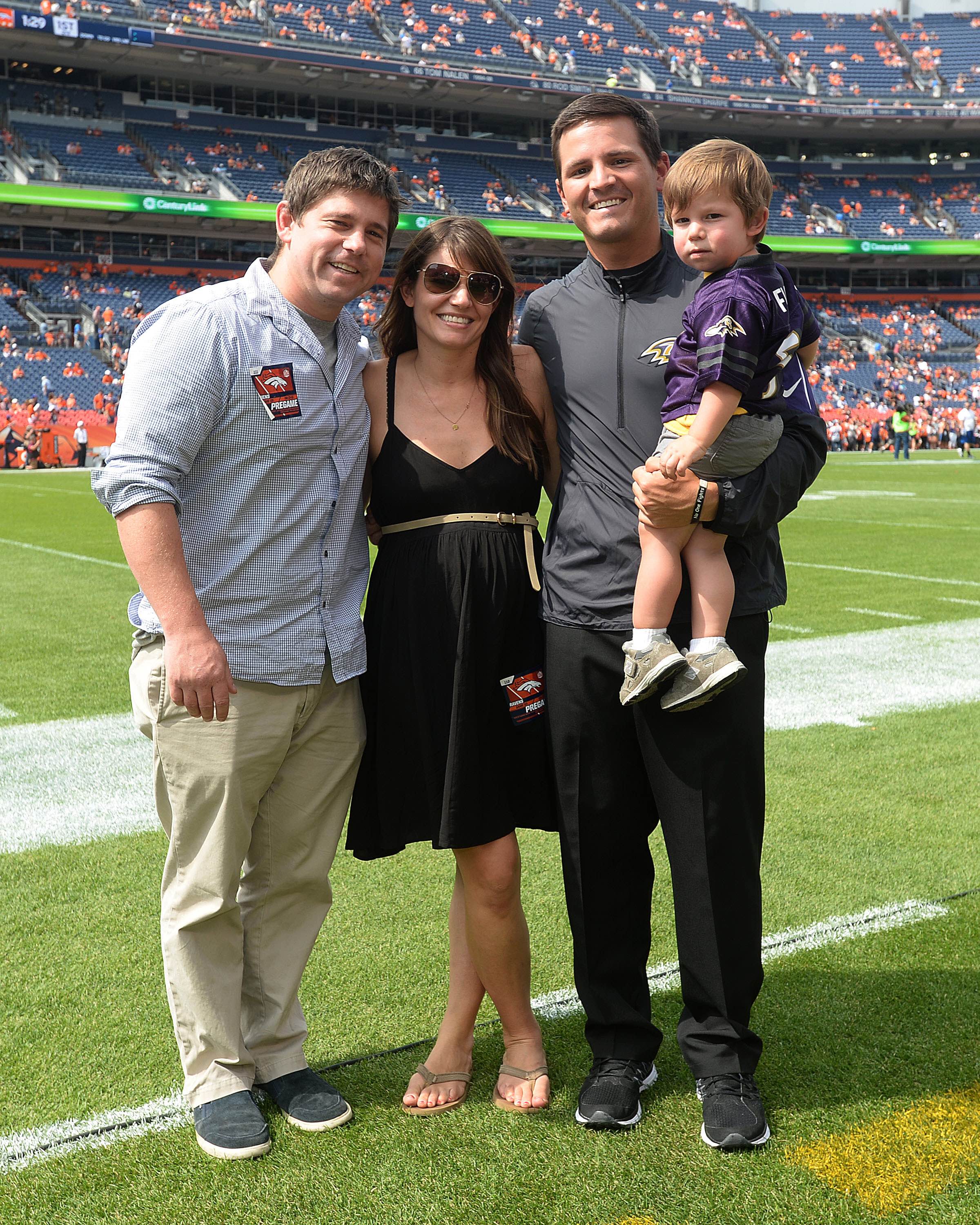 Mike in his happy place...with family standing on a football field.