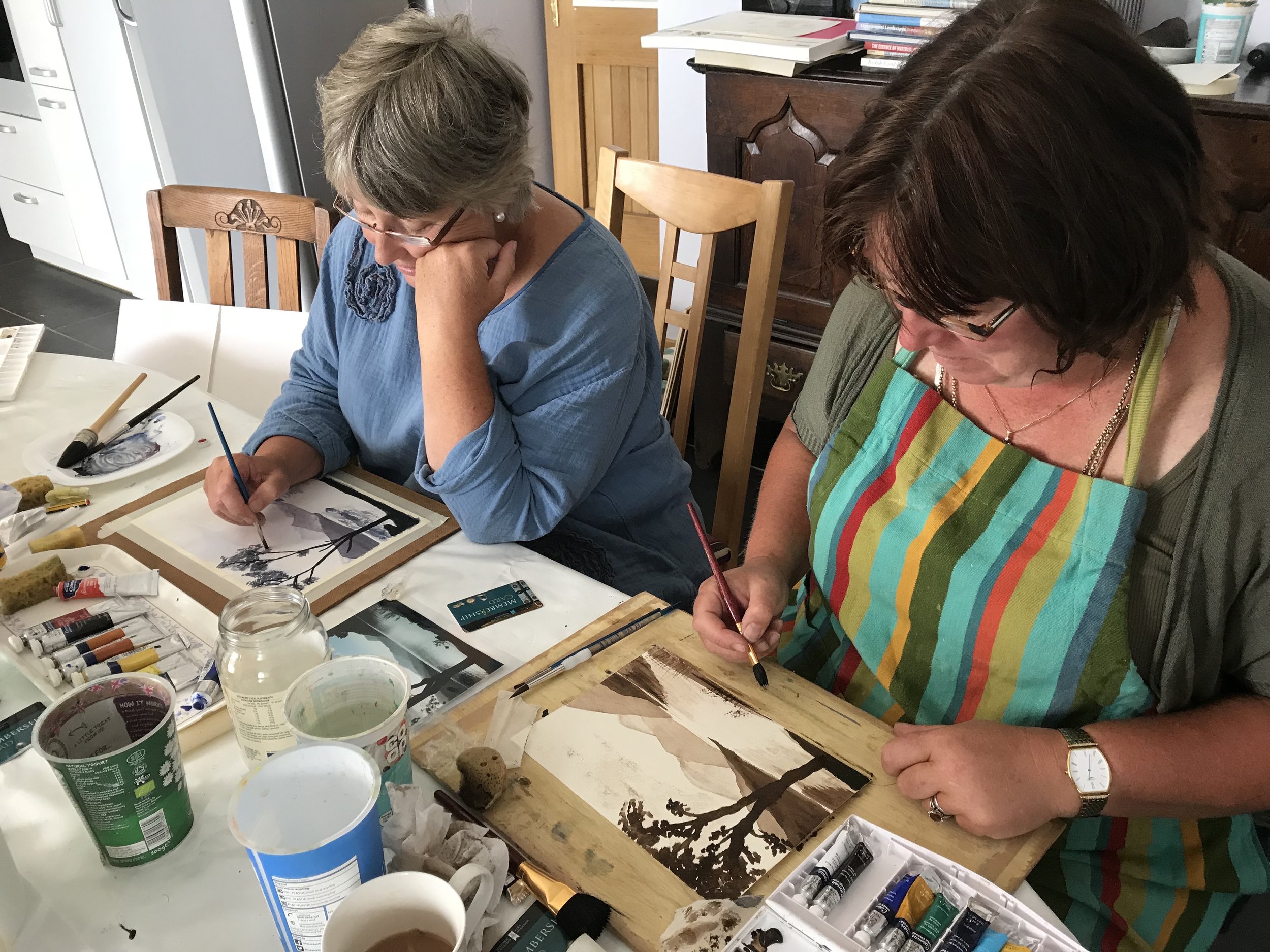 Students engrossed in their paintings