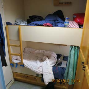 Our cozy cabin equipped with bunk beds and closets