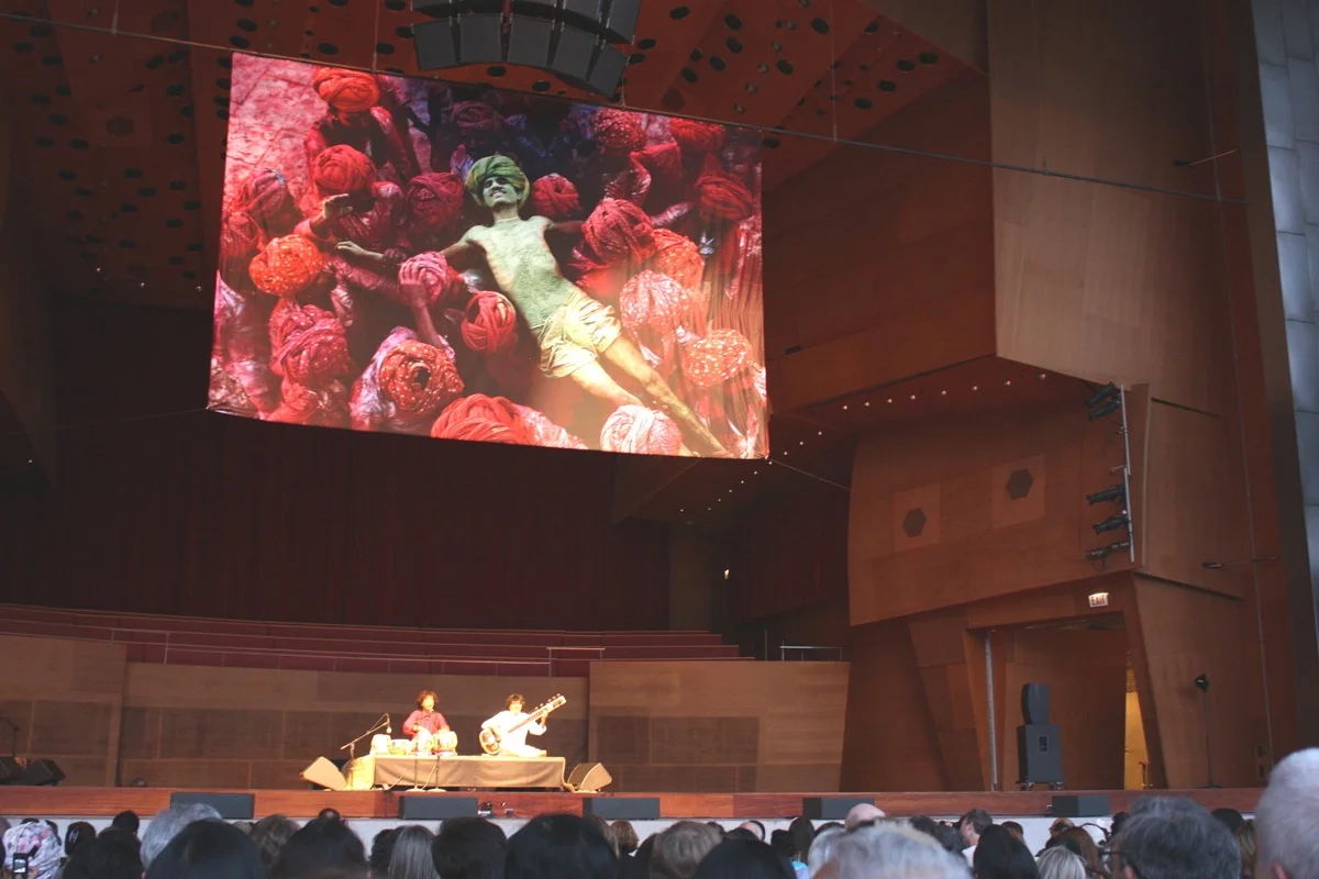Curator, Producer, Consultant of India Calling! Festival for National Geographic Traveler and India Tourism Board. Artists Zakir Hussain and Niladri Kumar in photo at Millennium Park, Chicago, 2010.