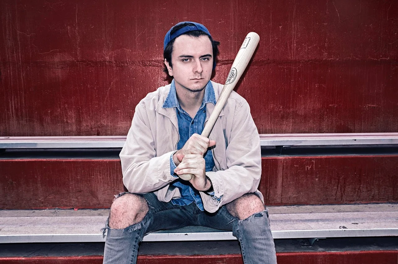 Cubbi in his own clothes shot by Sydney Easton for "Negative Spaces" album release press photos.