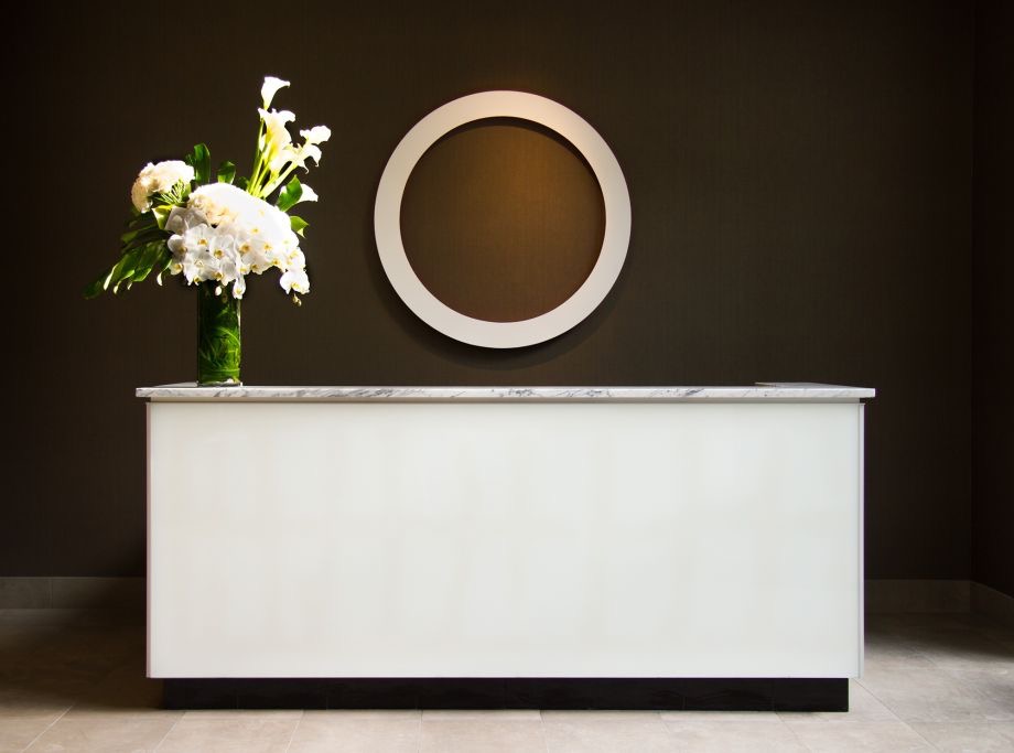 A typographic sculpture inviting attention to the welcome desk