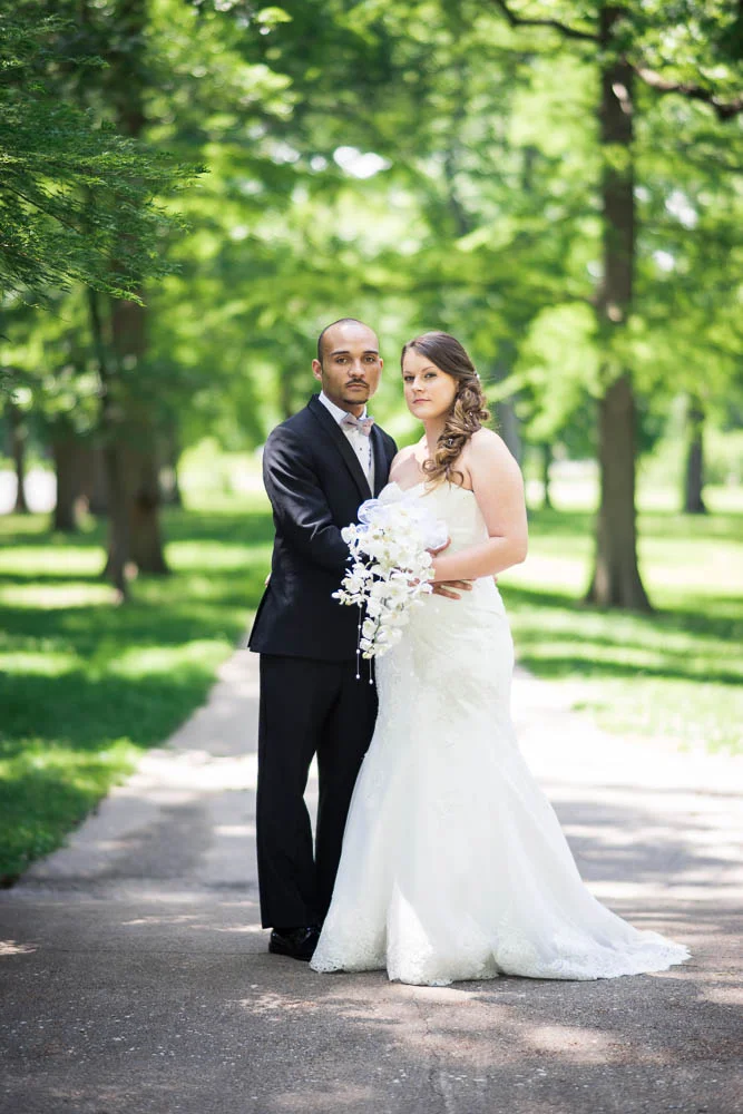 A portrait of a bride and groom in Tower Grove Park.