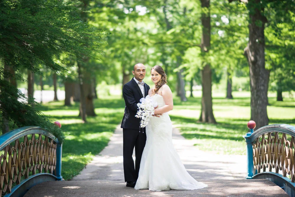 A portrait of a bride and groom in Tower Grove Park.